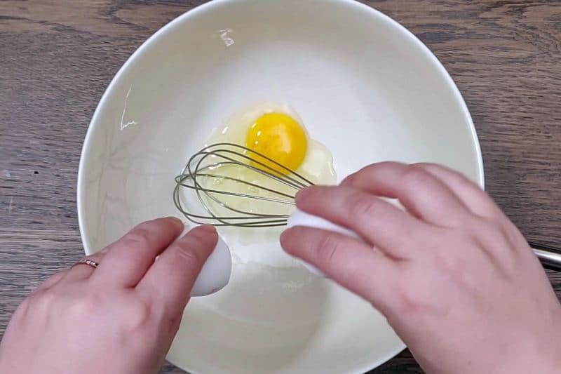 breaking eggs in bowl. 