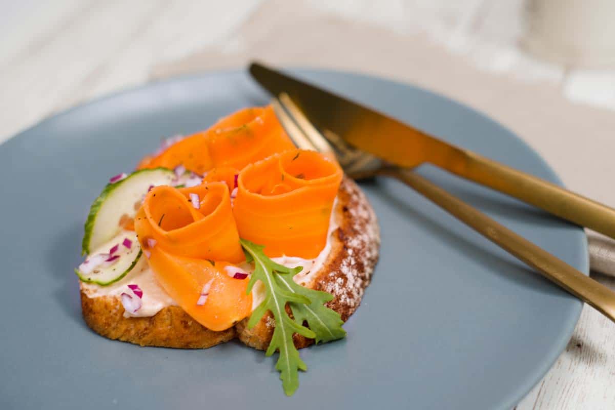 carrot salmon sandwich on plate.