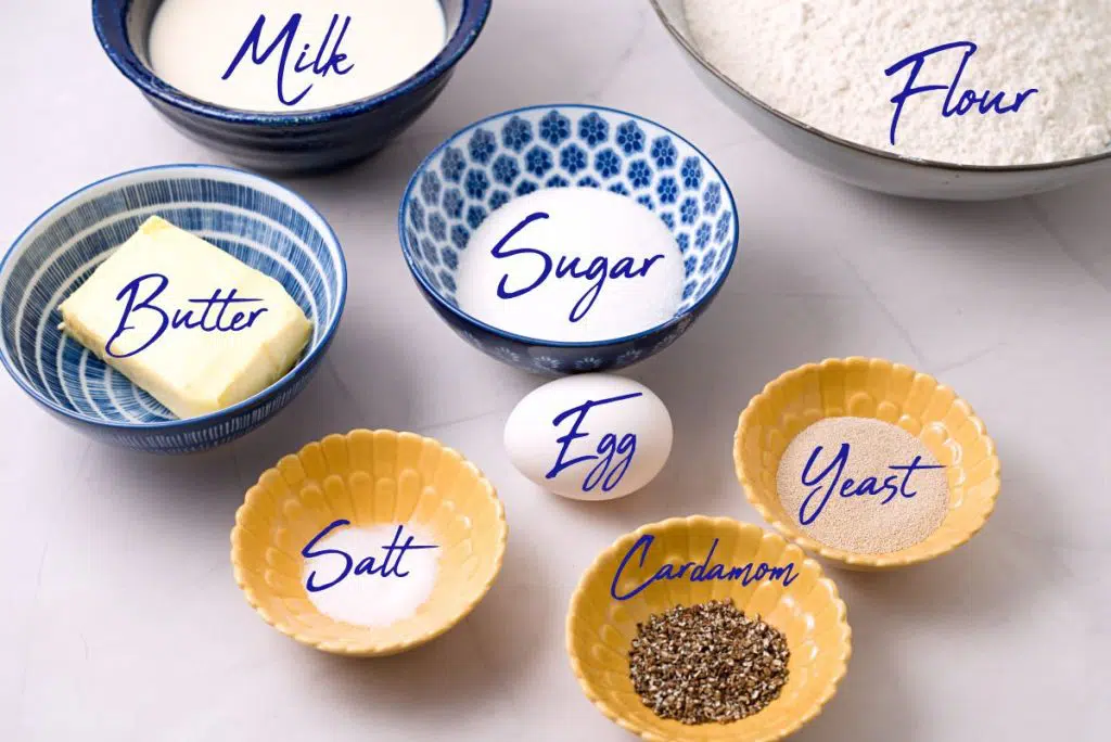 ingredients in small and bigger blue bowls with text labels. 