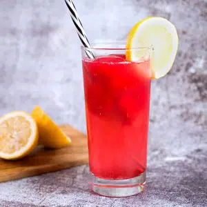 red drink in highball glass.