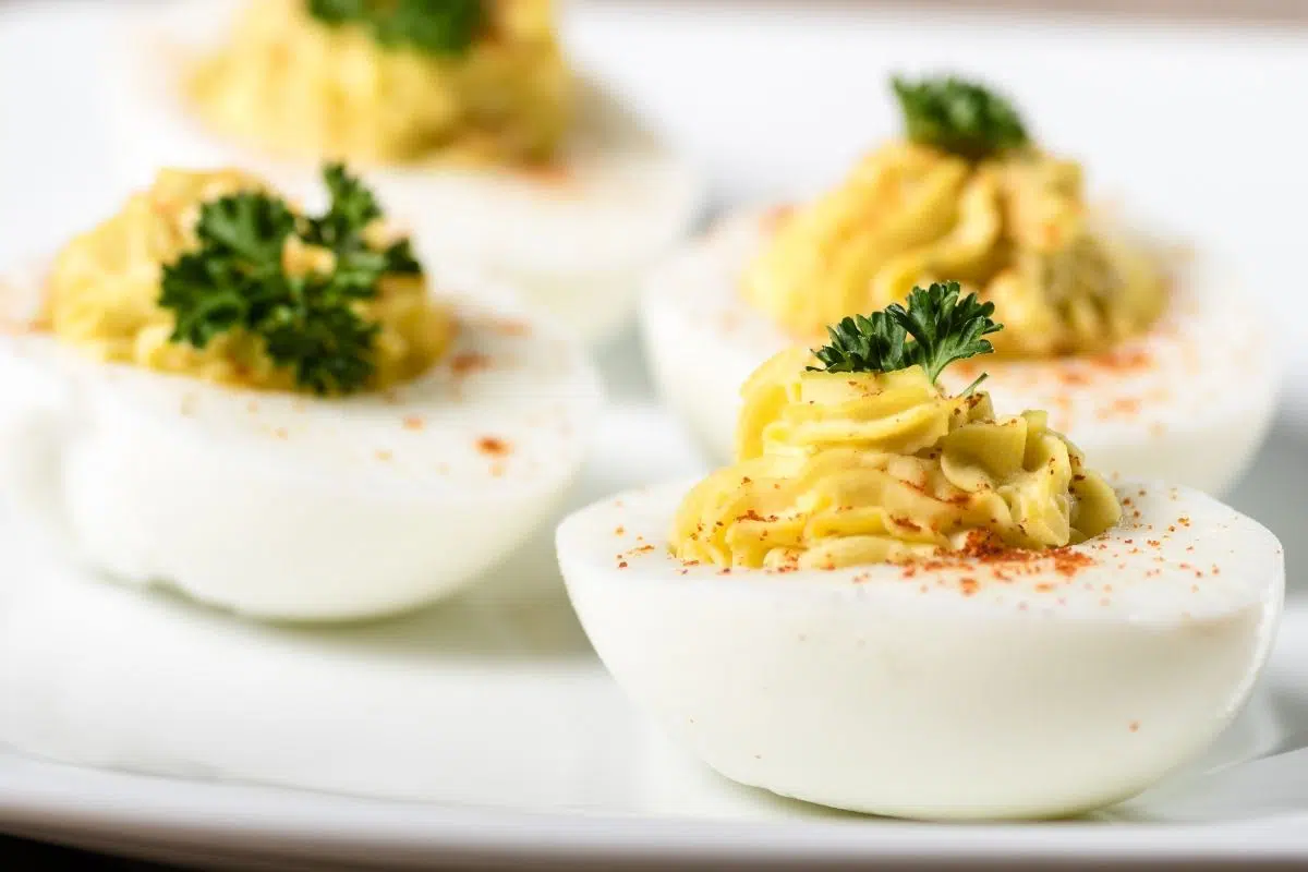 deviled eggs with yellow filling. 