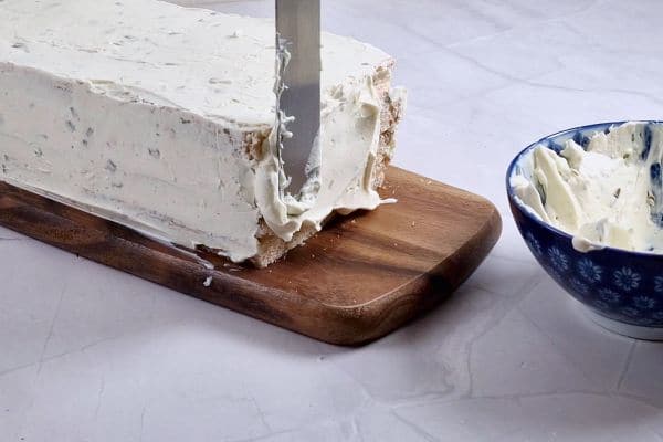 spreading cream cheese on the edges with a palette knife. 