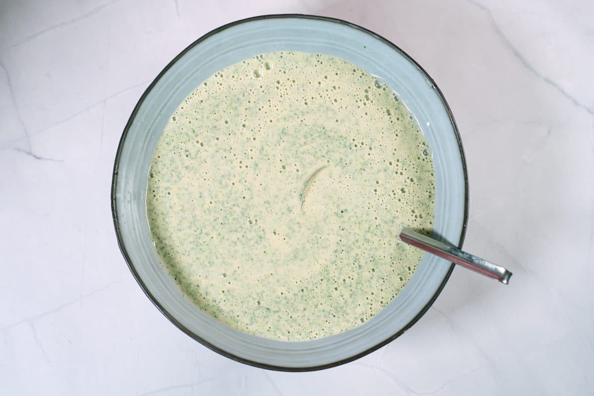 nettle pancake batter in bowl with a 