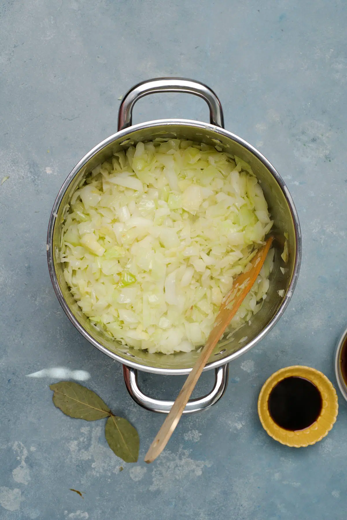 fried cabbage pieces in big pot.