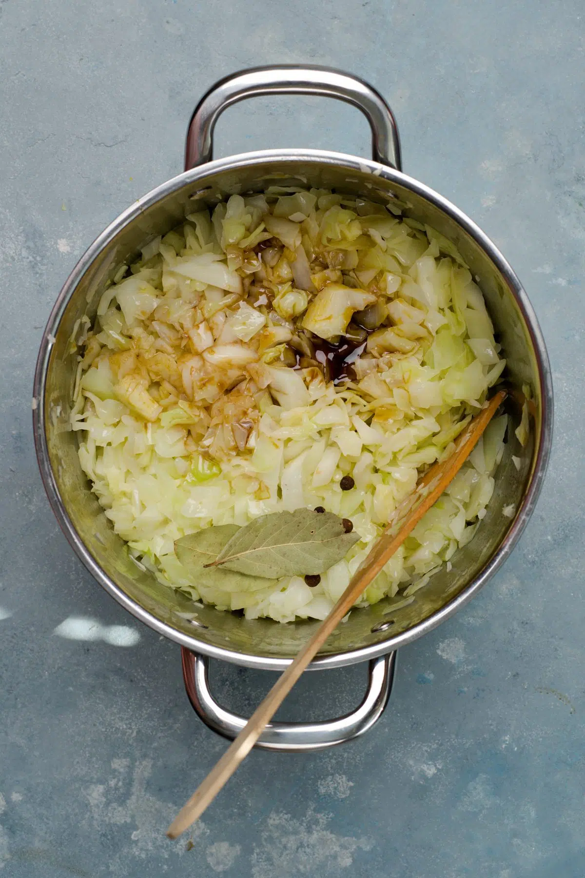 addiotional ingredients and spices on the fried cabbage. 
