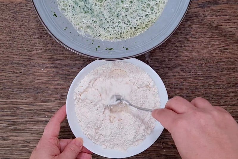 mixing flour in a bowl. 