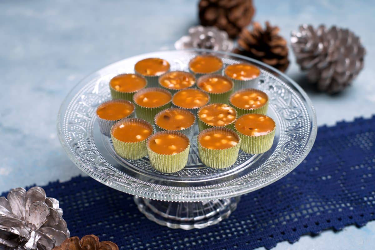 brrown candies in foil cups served.