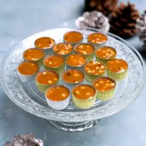 small toffee caramels with almond on a plate.