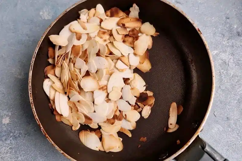 small pan with toasted almond slices. 