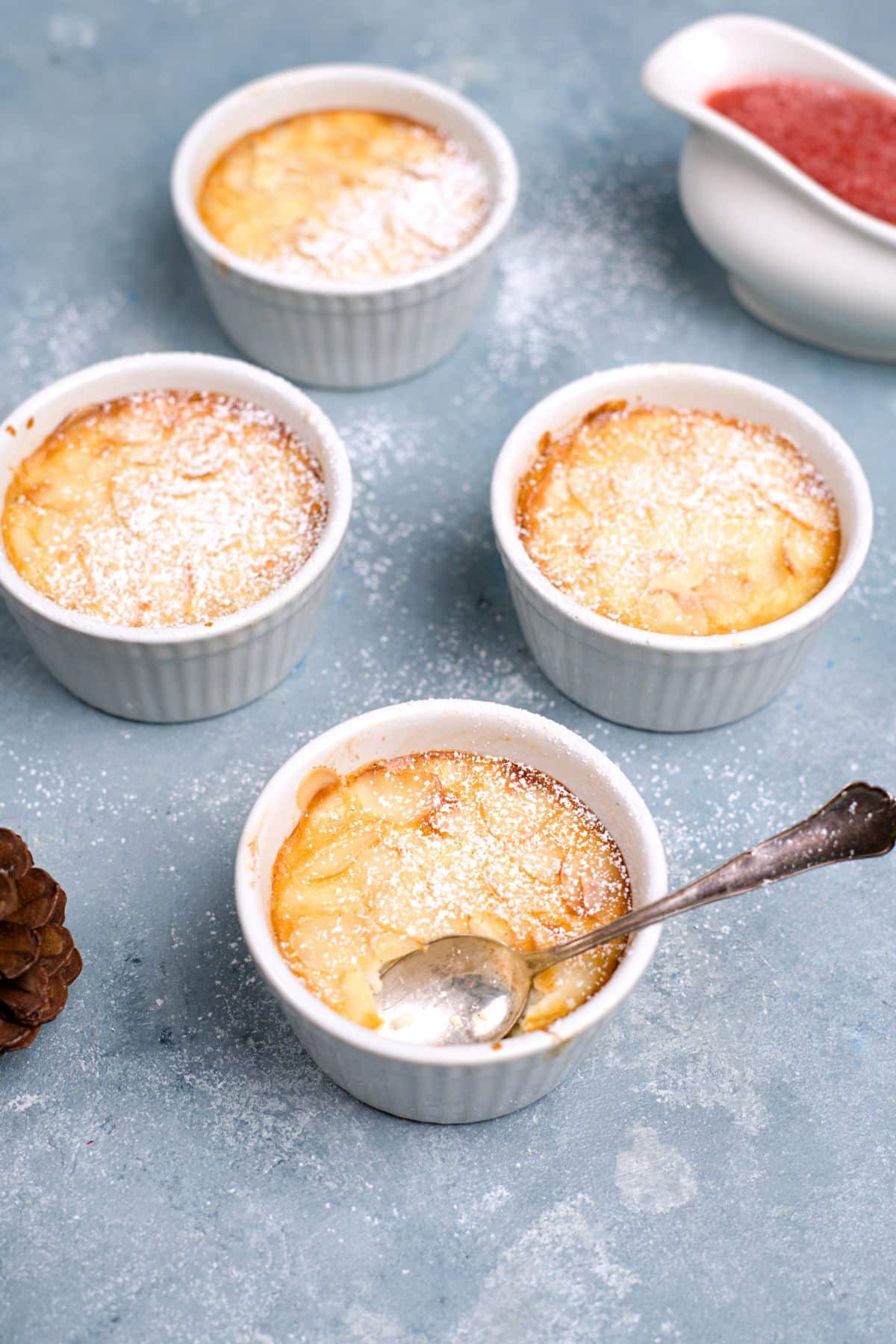 small ports with oven baked rice pudding and almonds on top. 