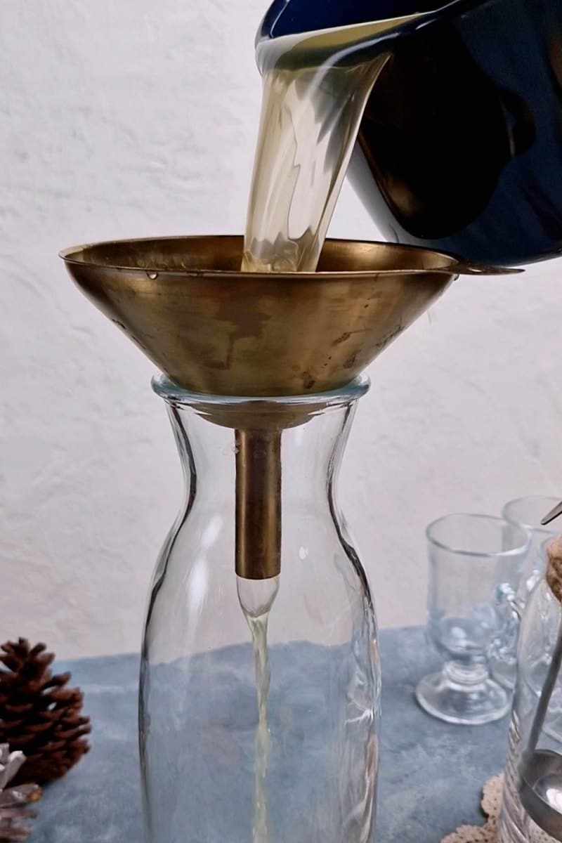 liquid being poured through a strainer. 
