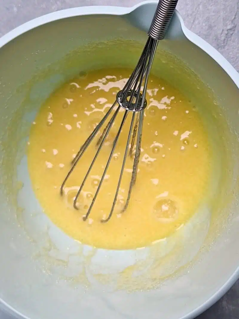 egg and sugar mixed but not whisked to a fluff. 