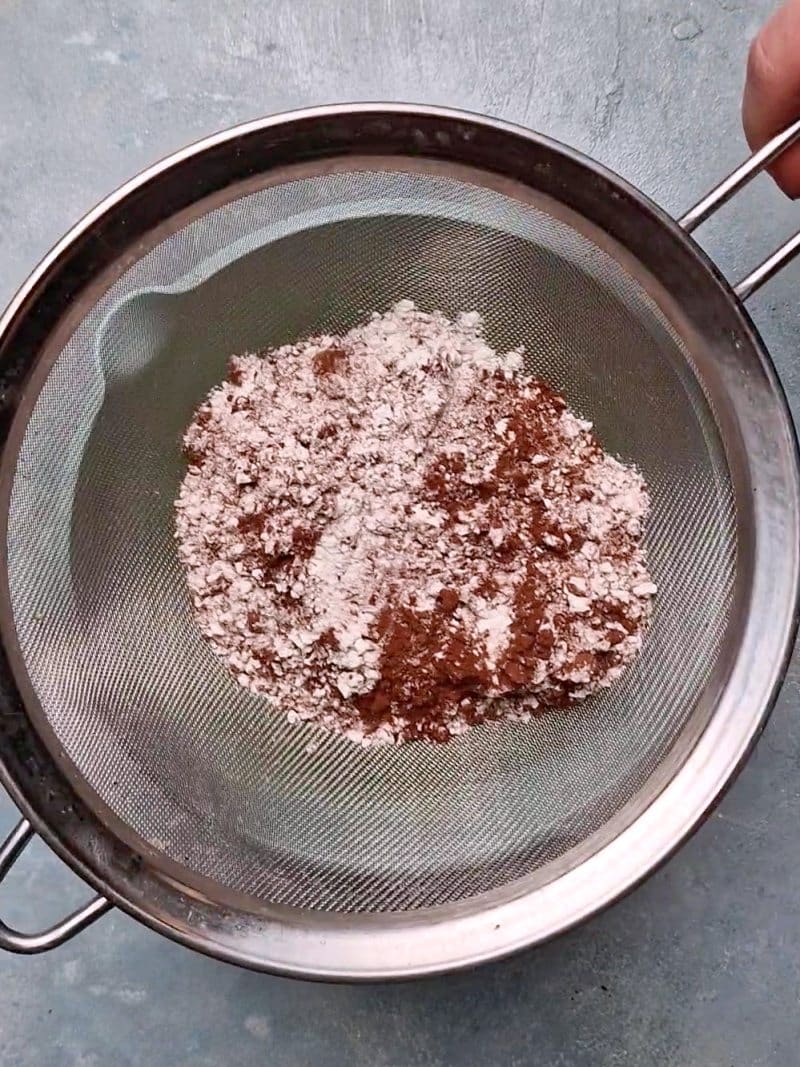 flour mix in a sieve above the egg bowl. 