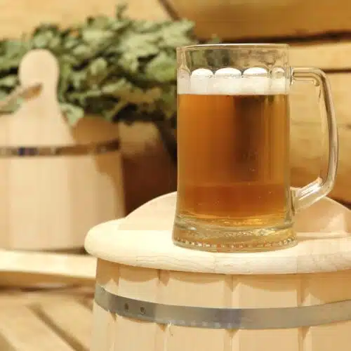 a large beer in glass in sauna