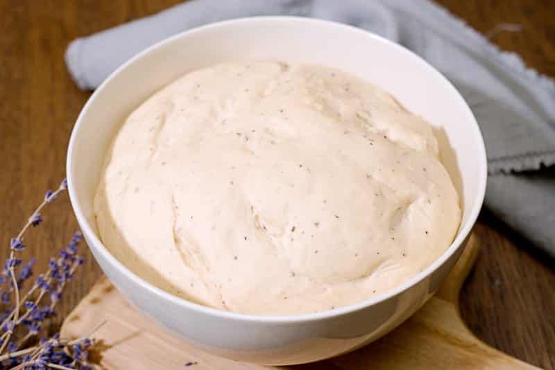 bun dough in bowl rising.