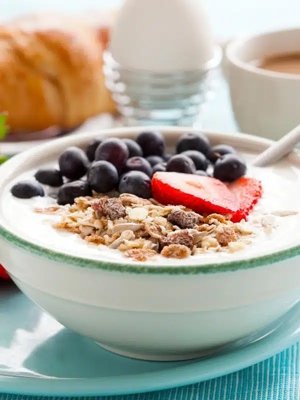 closeup on yogurt bowl with musli and berries. 
