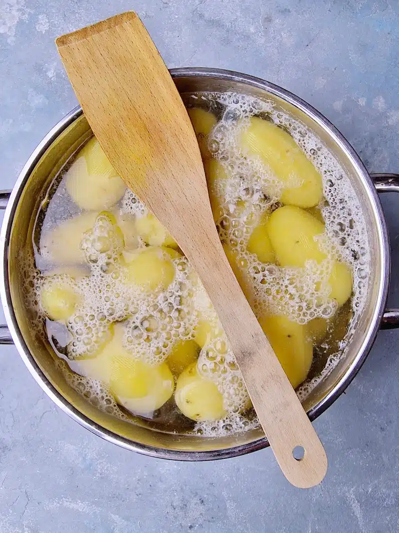 boiling potatoes in pot. 