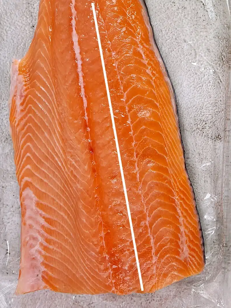 Salmon fillet with line to show where the bones are. 
