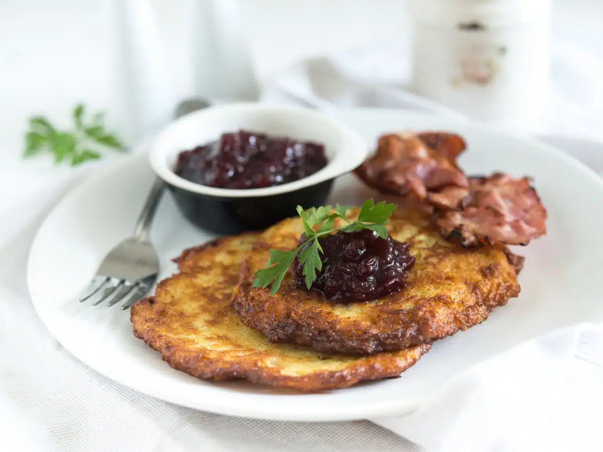 potato pancakes with crispy bacon and lingonberry jam. 