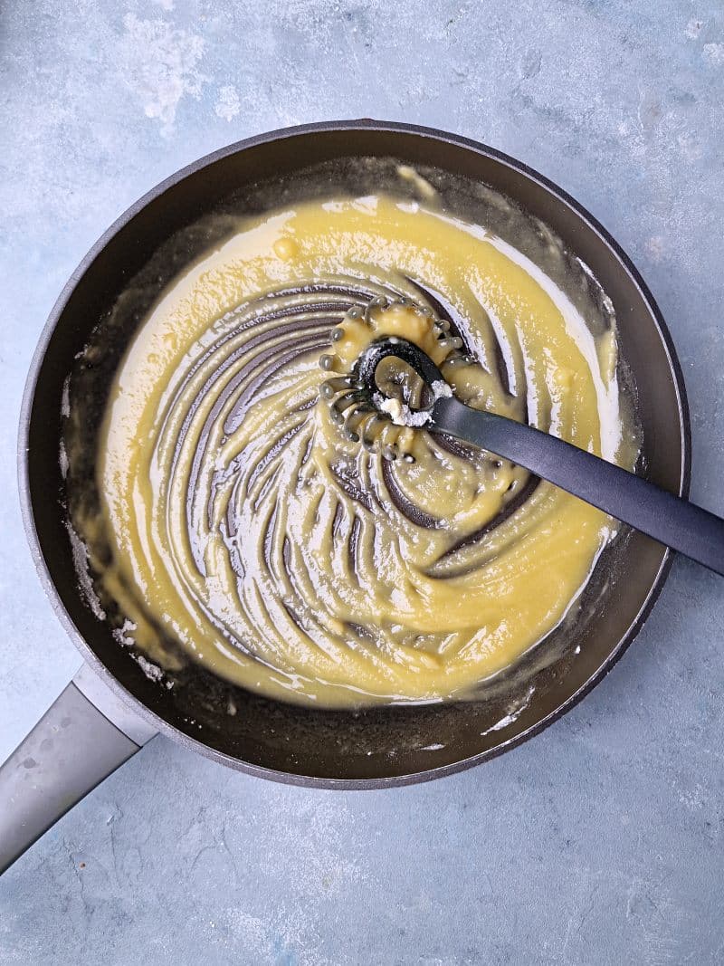 melted butter and flour mix on pan with a plastic whisk. 