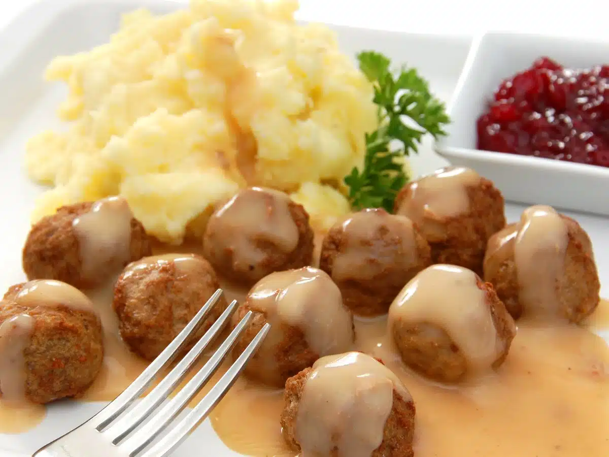 Meatballs in gravy with mash and lingonberry jam. 