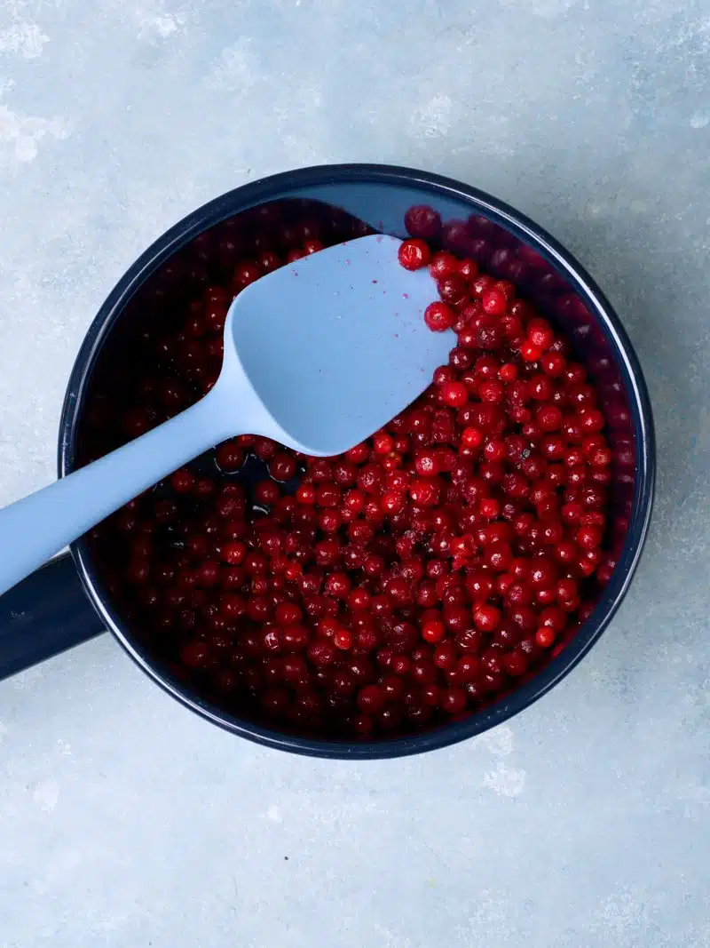 Lingonberries in a blue pot. 