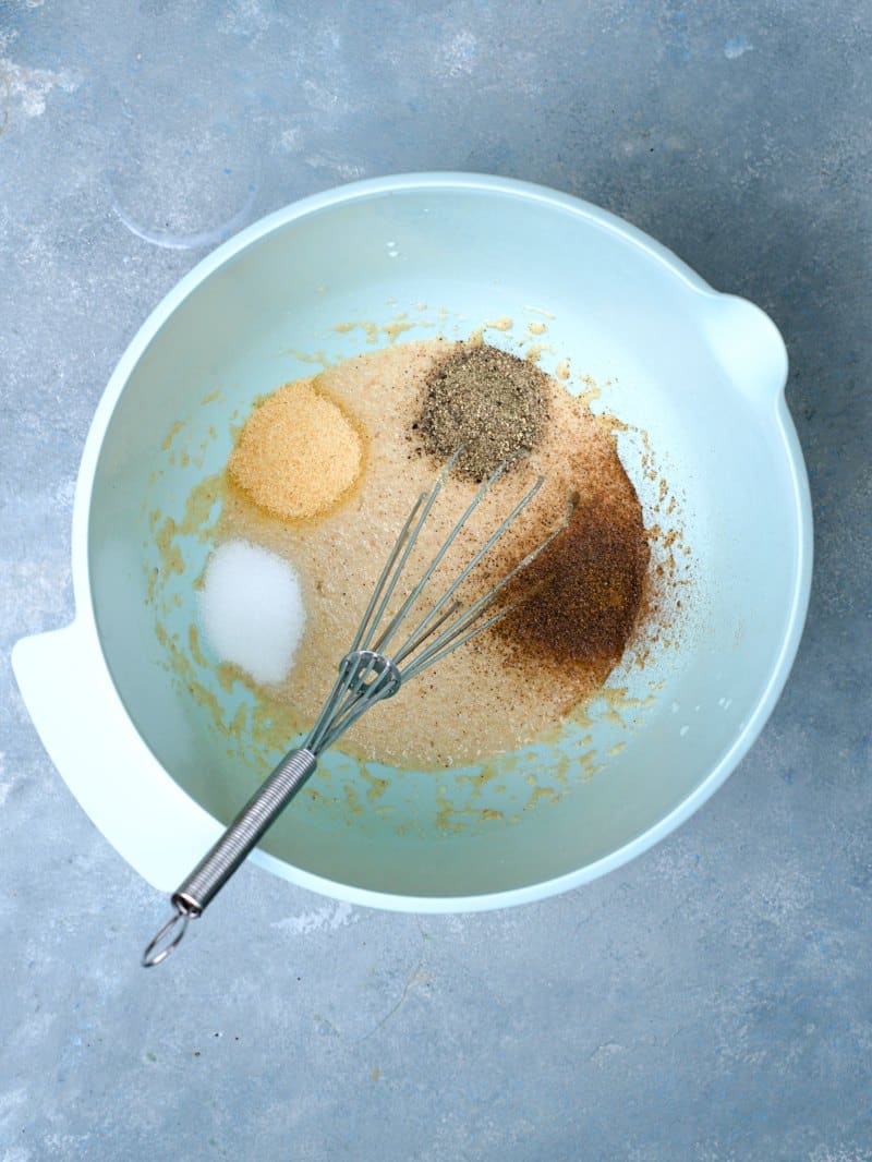 milk, breadcrumbs and spices in bowl. 