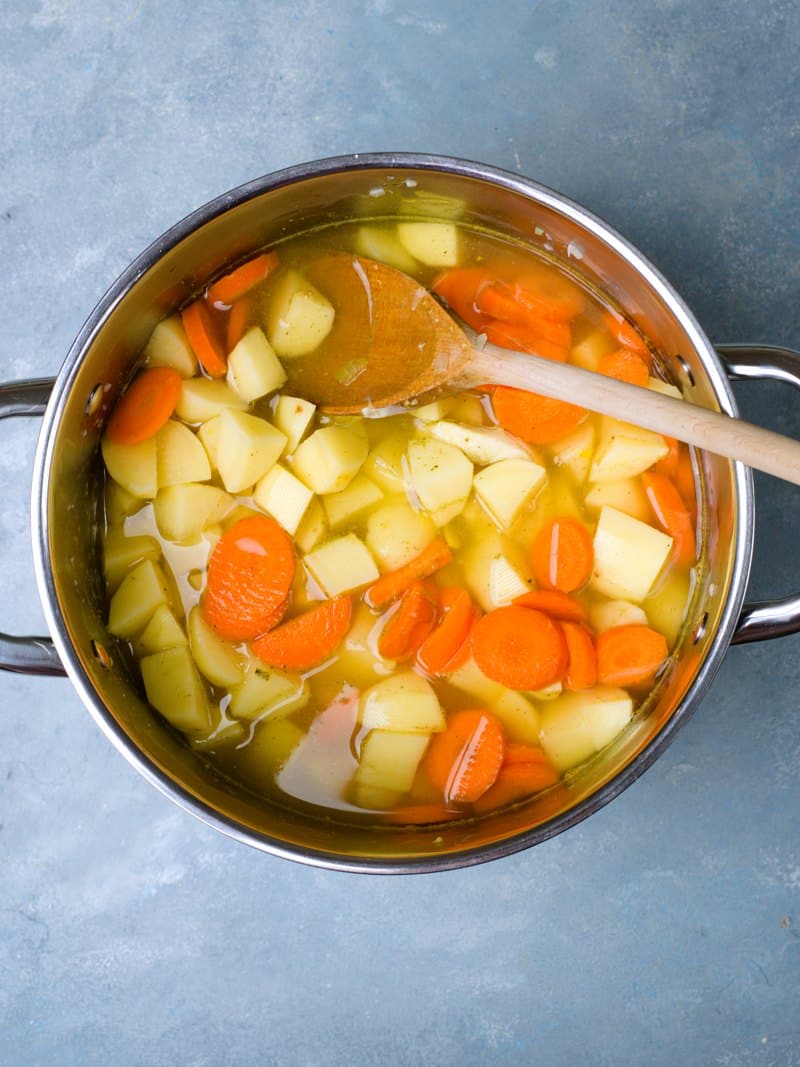 soup in pan added potatoes and carrots. 