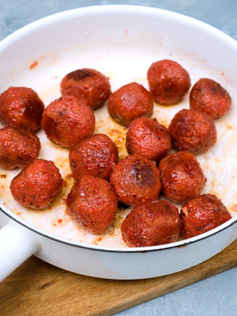 Fried meatballs in white pan. 