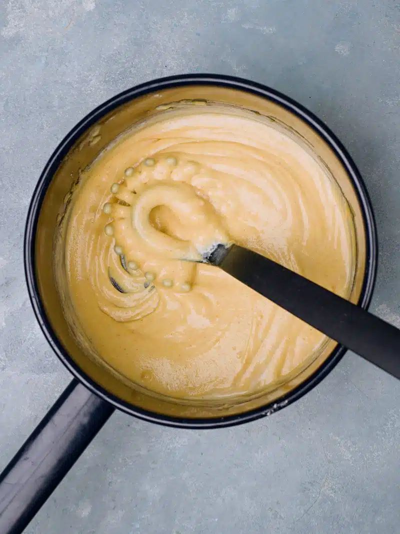 Yellow sauce in bowl. 