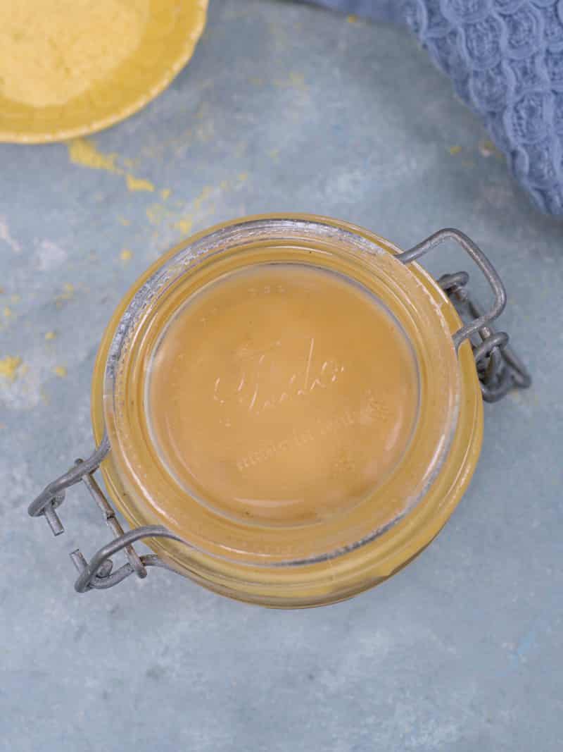 Mustard in a glass jar. 